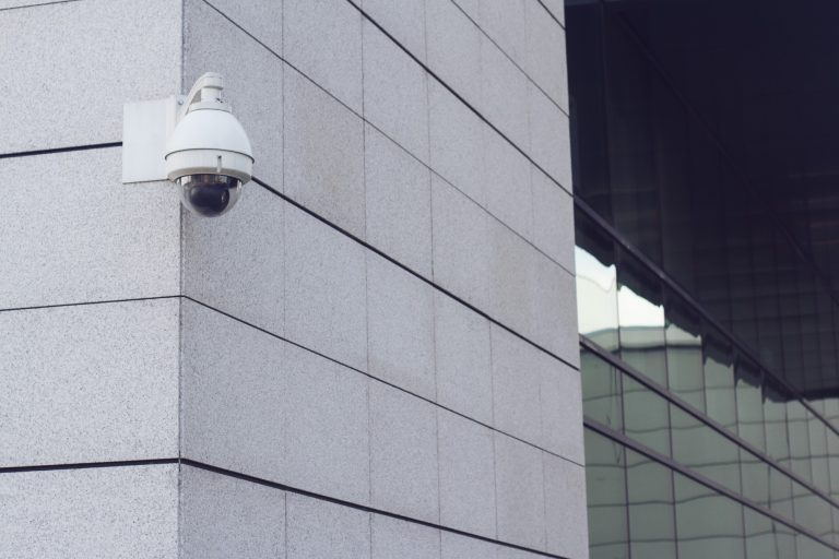 surveillance-round-camera-on-building-wall-2022-06-15-22-15-18-utc